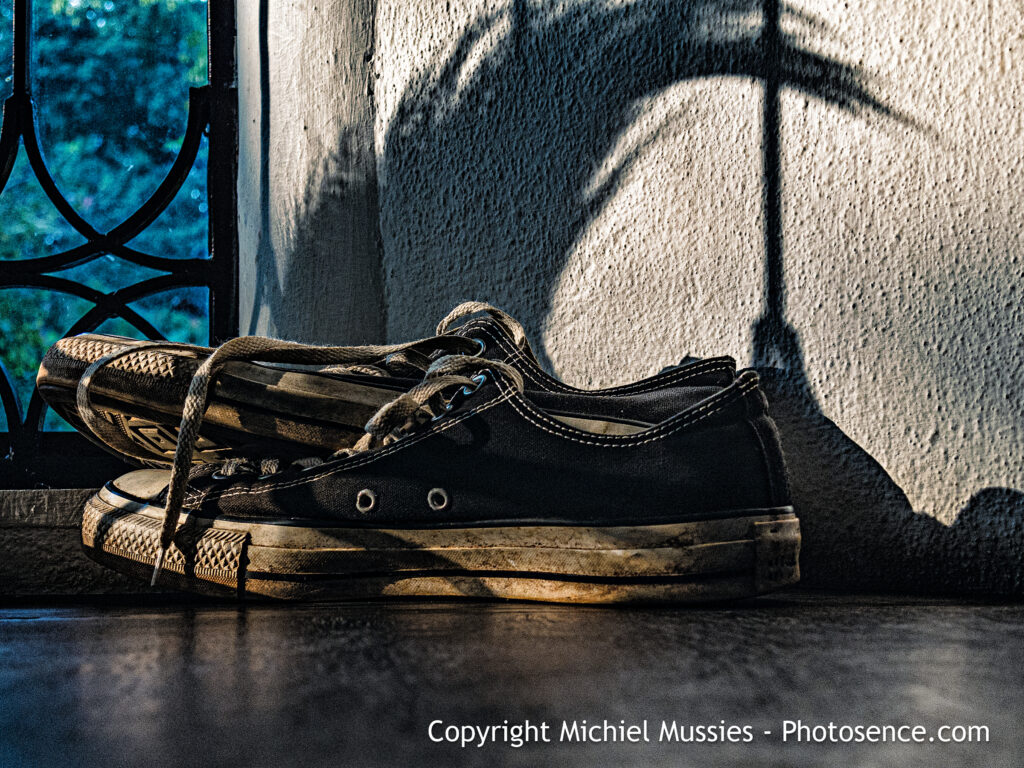 Product image for colour print depicting a pair of shoes in the afternoon sunlight